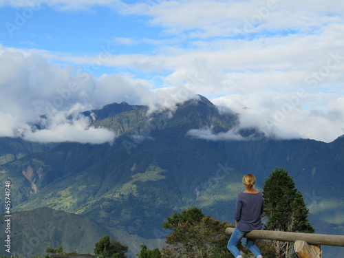 Woman enjoying the spectacular view of mountain range in Ecuador South America photo