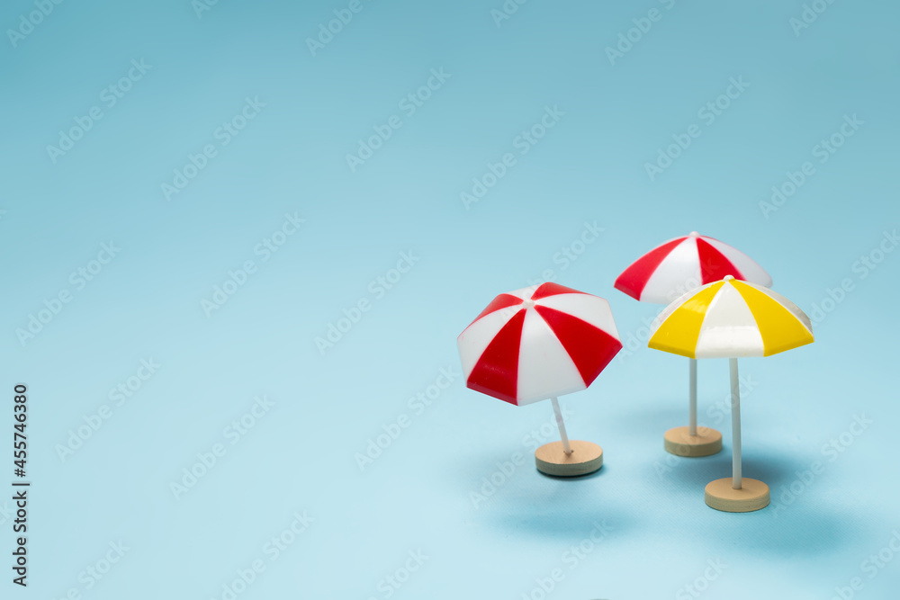 Yellow and red umbrella on a blue background.