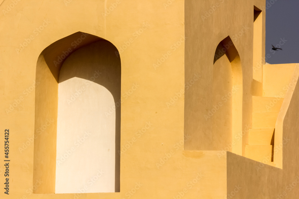 The exterior facade with arched windows of the ancient astronomical ...