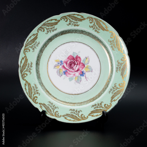 Photography olg green porcelain plate with flowers