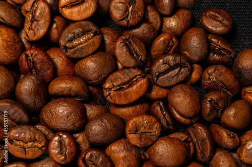 Natural background for Cafe menu or brochure template - macro photo of brown roasted coffee beans  close up