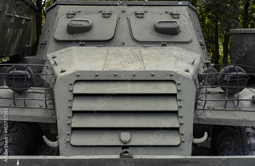 a fragment of the frontal armor of an armored personnel carrier with grille elements