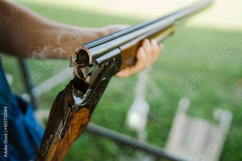 Mid Adult Man Training His Aim and Concentration Using a Shotgun in a Clay Pigeon Shooting Field Sport Centre 