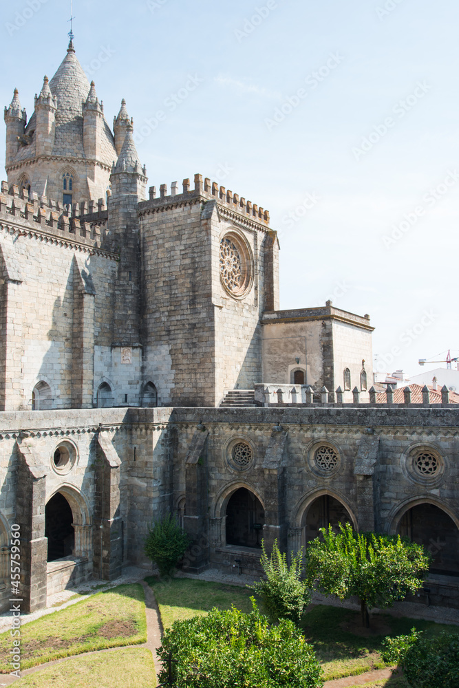 View of cloister and Cathedral at Evora. Park in the interior. Portugal, Europe