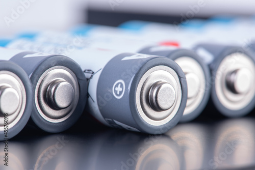 Closeup of alkaline batteries aa size in row with blurred background