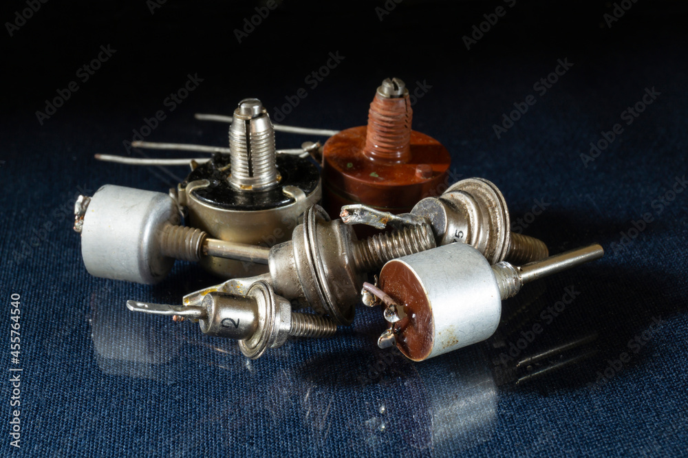 The radio components are lying on the table with a reflection The radio components are lying on the table with a reflection