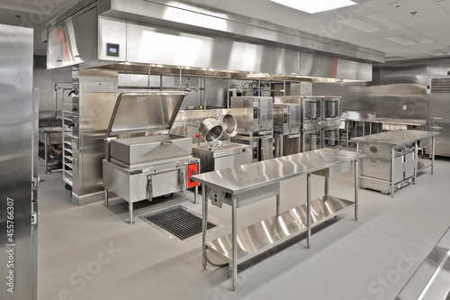 Interior of modern restaurant cafeteria hotel kitchen with stainless steel appliances