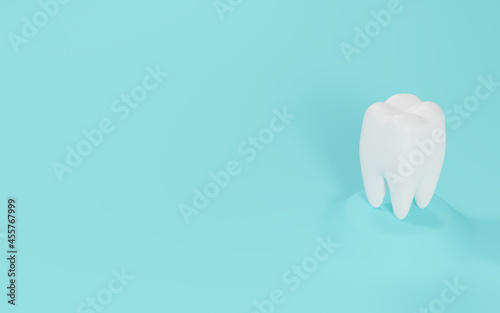 White tooth on turquoise, blue background
