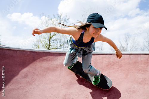 Cool skater girl in a skate park photo