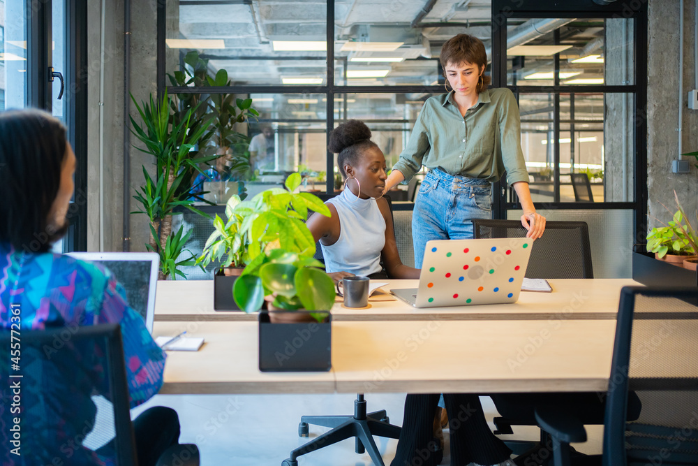 Colleagues In A Coworking Workplace. Colleagues In A Coworking Workplace.