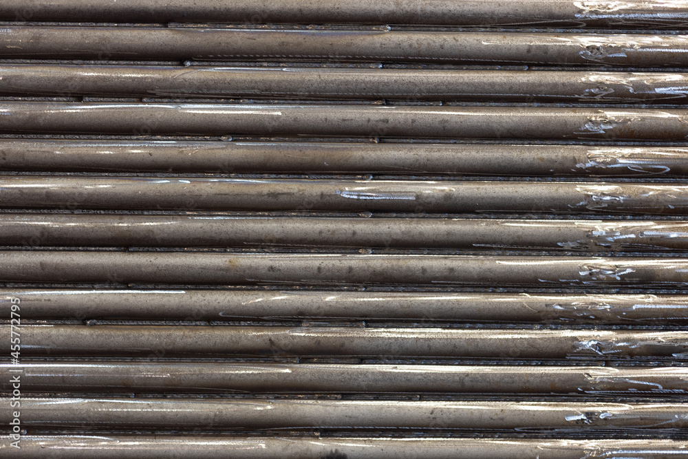 Obraz premium metal background. industrial background from horizontal pipes welded to each other