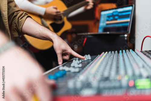 Person using equalizer in studio