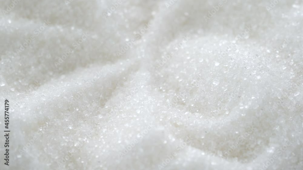 Mountains of white crystalline sugar shine beautifully and rotate. High quality FullHD footage Mountains of white crystalline sugar shine beautifully and rotate. High quality FullHD footage