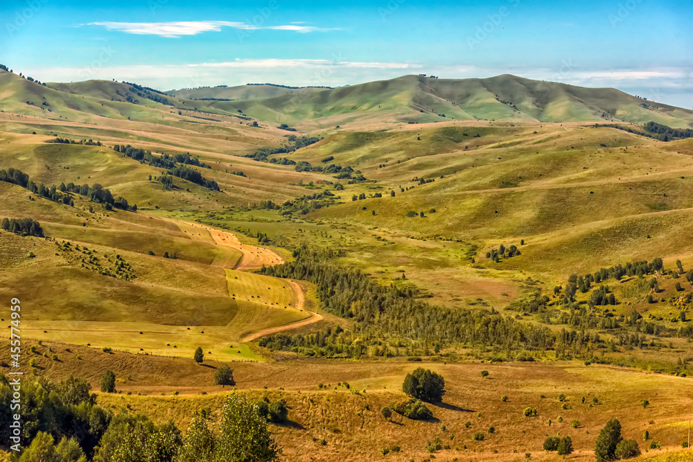 Summer landscape with hills and mountains of the Altai.