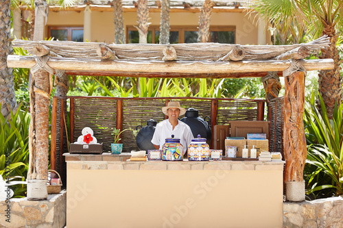 Portrait of staff person at pool bar at tropical resort