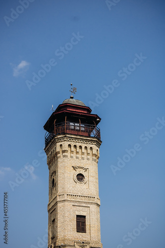 An old brick fire tower. Tower against a clear blue sky