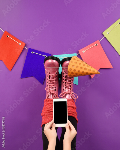 Girl Holding Party Birthday Invitation on Cell Phone photo