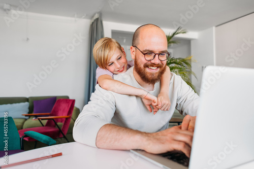 Father and Son Doing Homework Together  photo