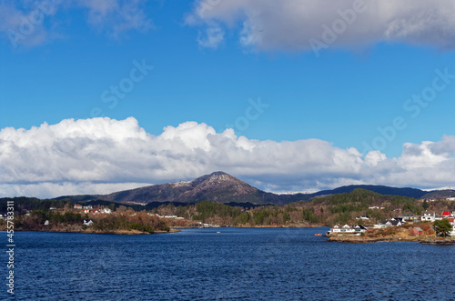 Small Islands within the Bergen Fjord with Traditional Norwegian Houses and Cabins set amongst the rocky headlands and outcrops.