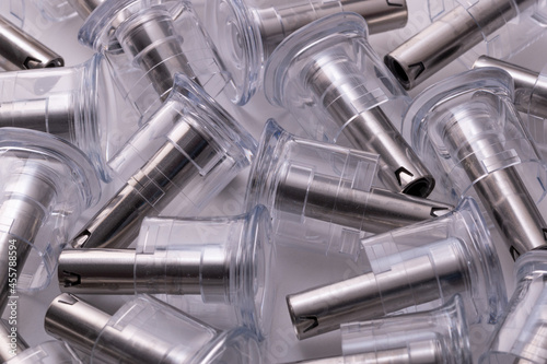 Abstract image of medical plastic and steel product part , Made from injection molding machines