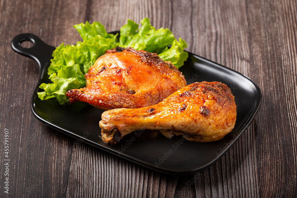 Roasted chicken pieces with lettuce salad. Roasted chicken pieces with lettuce salad.