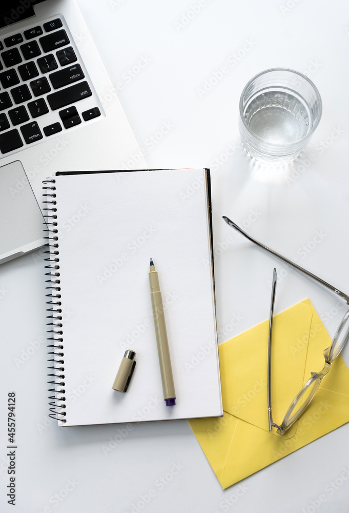 Blank notebook on white desk Blank notebook on white desk