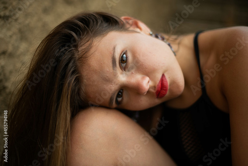 cheerful young girl spending good time at the beach. Beauty portrait. Сute teenage girl or woman on the beach nature landscape fresh air beach. Natural beauty. lifestyle/ real people/ funny/ dance.