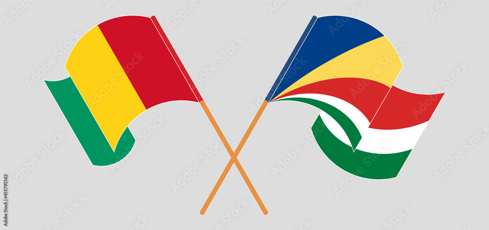 Crossed and waving flags of Guinea and Seychelles Crossed and waving flags of Guinea and Seychelles