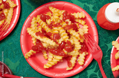Messy Plates of French Fries and Ketchup From Above 