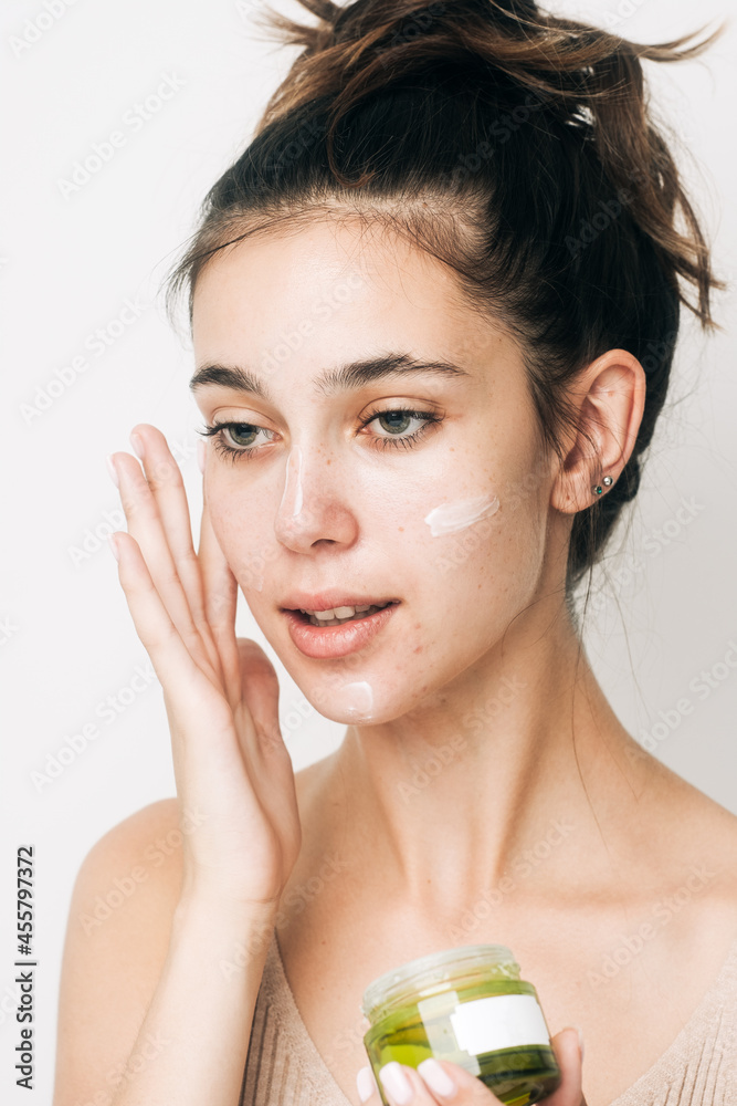 Brunette Woman Applying Face Cream Brunette Woman Applying Face Cream