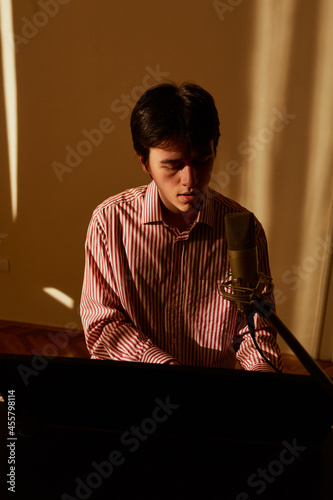 Portrait Of A Young Man Playing The Piano  photo