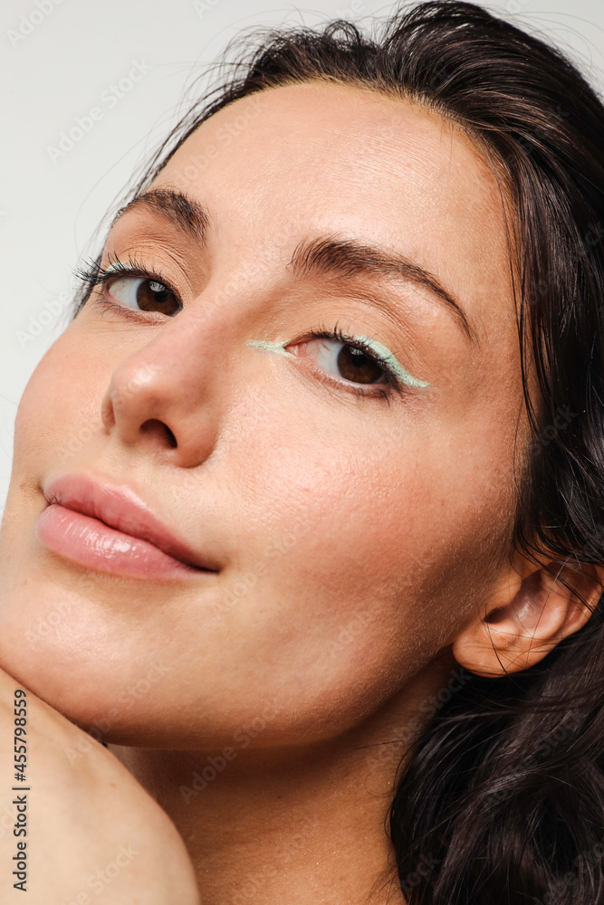 Young woman with green eyeliner makeup on smiling Young woman with green eyeliner makeup on smiling