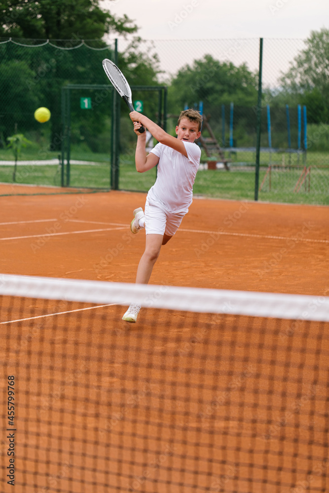 Young tennis player on the outdoor court. Young tennis player on the outdoor court.
