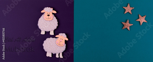 Eid Al Adha greeting card or background. Wool lambs figures against a purple and blue background. Feast of the Sacrif. Traditional Muslim holiday concept. Banner. photo