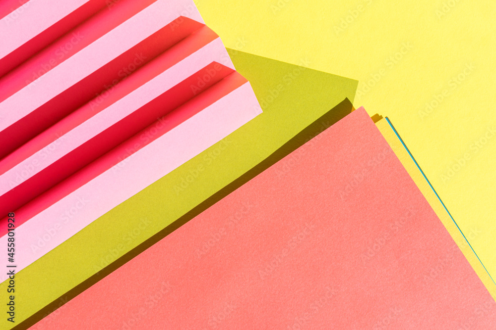 Abstract colored paper texture. Folded paper with harsh sun shadows, geometric shapes and lines. Minimalist background. Flat lay. Copy space. Abstract colored paper texture. Folded paper with harsh sun shadows, geometric shapes and lines. Minimalist background. Flat lay. Copy space.