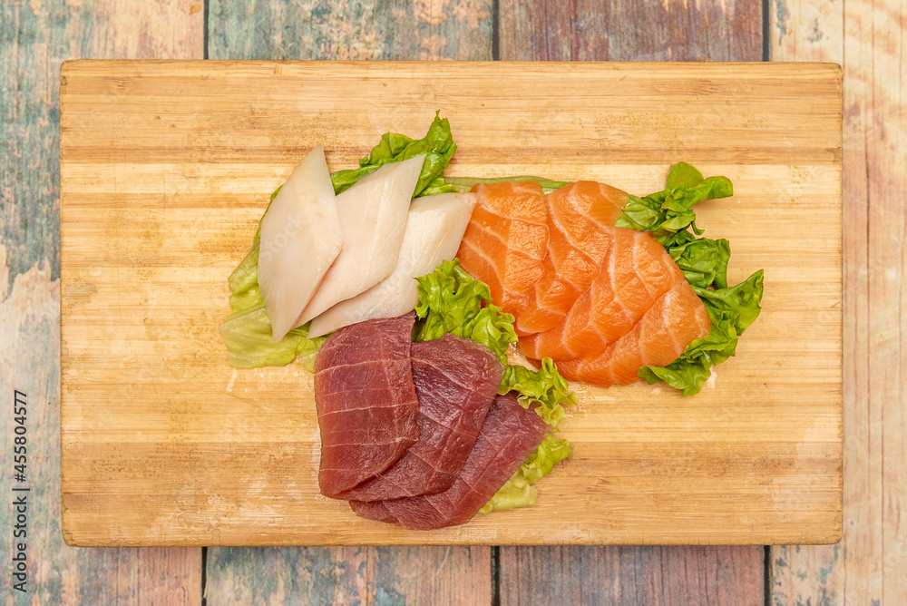 Great bamboo tray with pieces of Japanese sashimi sushi of bluefin tuna