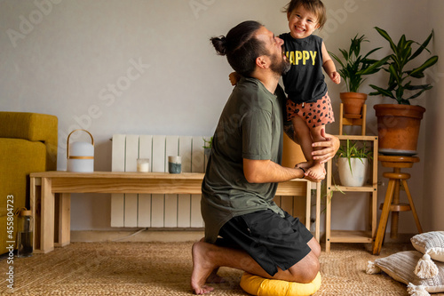 Family father enjoying his fatherhood at home photo