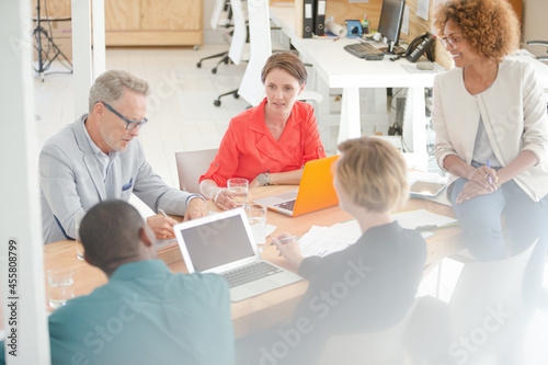 Office workers having meeting at desk