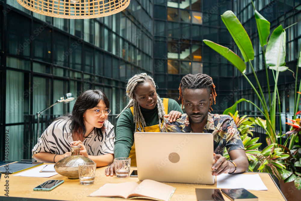 © Luis Velasco/Stocksy - Entrepreneurs Sitting Around The Table In The Office. © Luis Velasco/Stocksy - Entrepreneurs Sitting Around The Table In The Office.