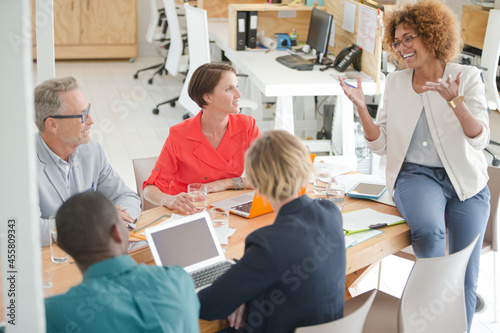 Office workers having meeting at desk