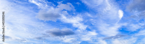 Fototapeta Naklejka Na Ścianę i Meble -  Panoramic summer sky with white clouds on bright blue horizon