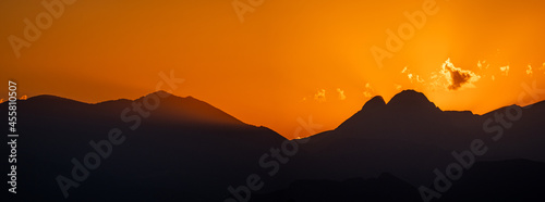 A sunset with the silhouette of the Pedraforca, a famous mountain in Catalonia.