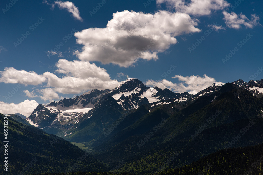 snow-covered peaks of the mountain range snow-covered peaks of the mountain range
