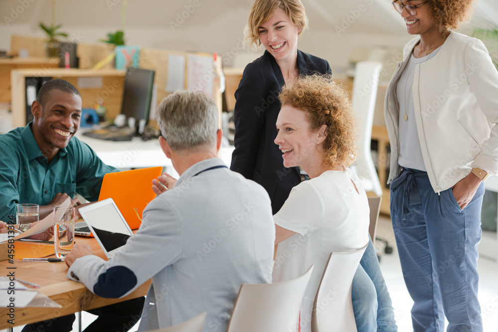 Fototapeta premium Office workers talking at desk