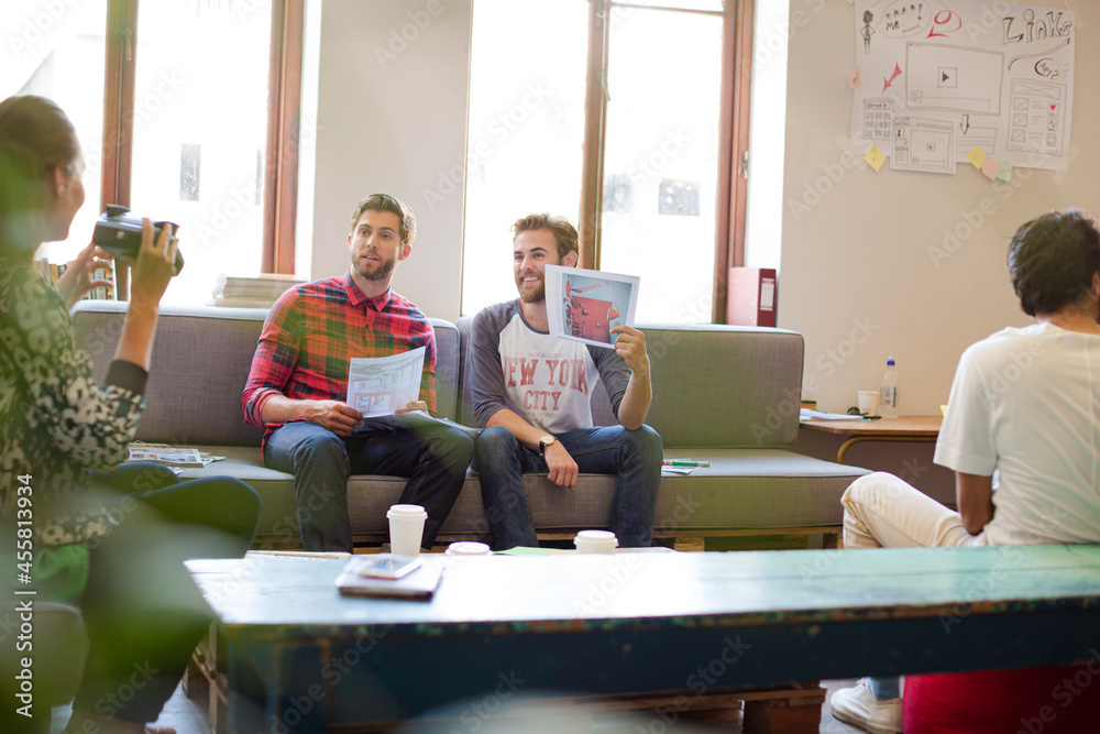 Smiling casual business people talking in office