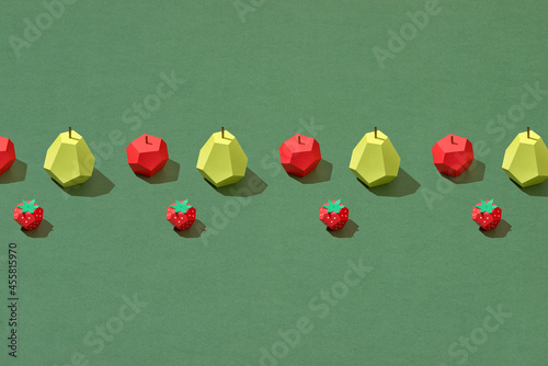top view of handmade colorful origami fruits on photo