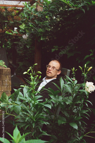 Man with down syndrome in garden. photo