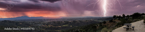 Lightning flashes over the mountains from the Top of the World in Laguna Beach