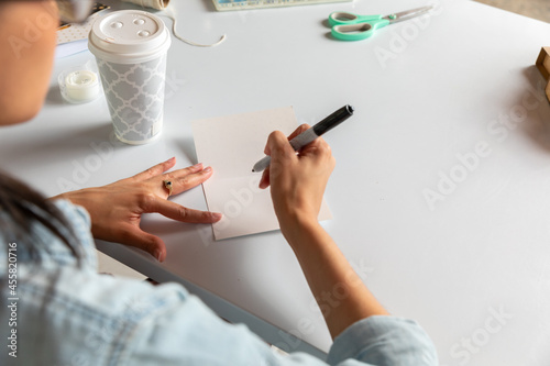 Woman Writes in Card