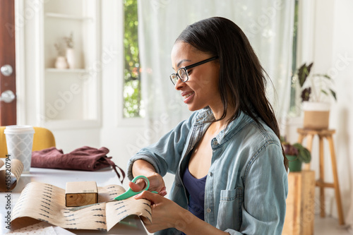 Small Business Owner Packages Boxes at Home